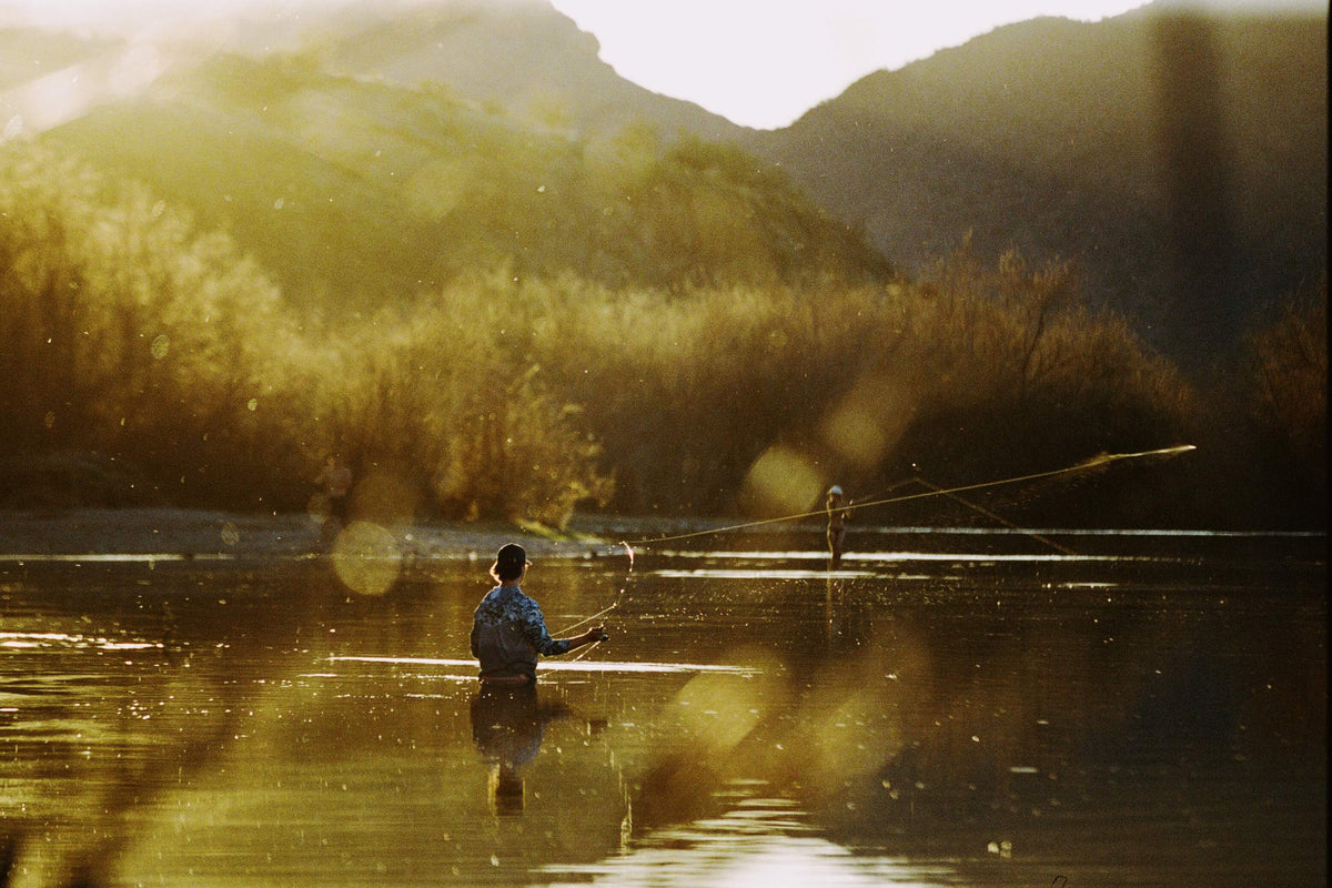 A man fishing in the salt river of AZ.